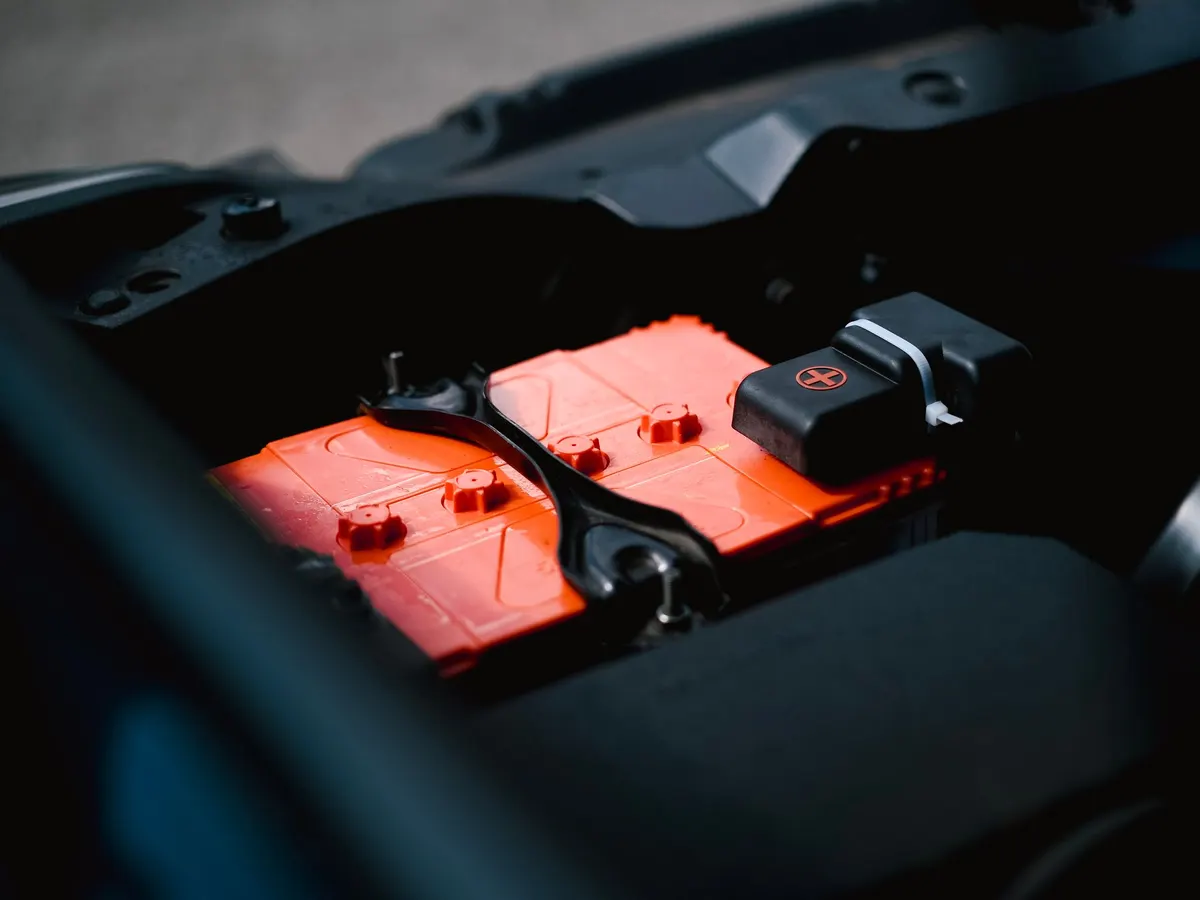 Car battery with red terminal covers
